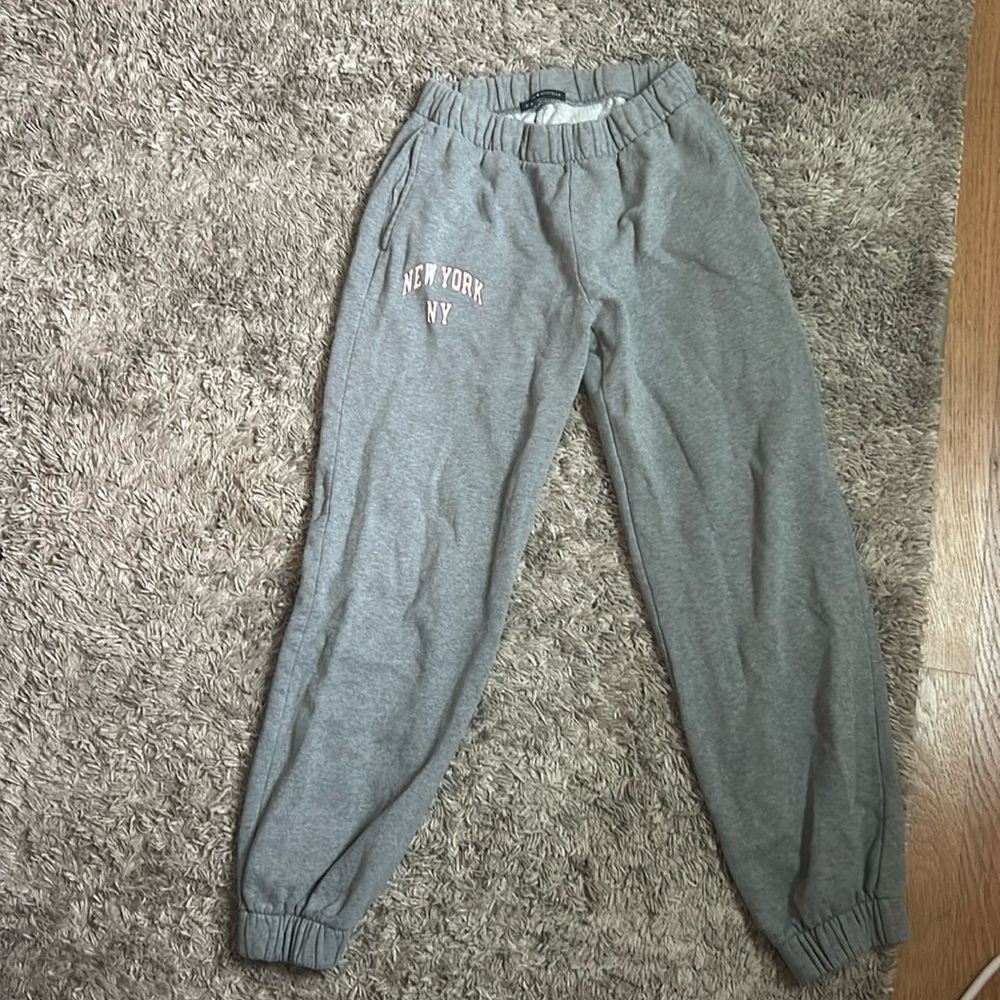 dark gray brandy Melville sweatpants with red and white New York print